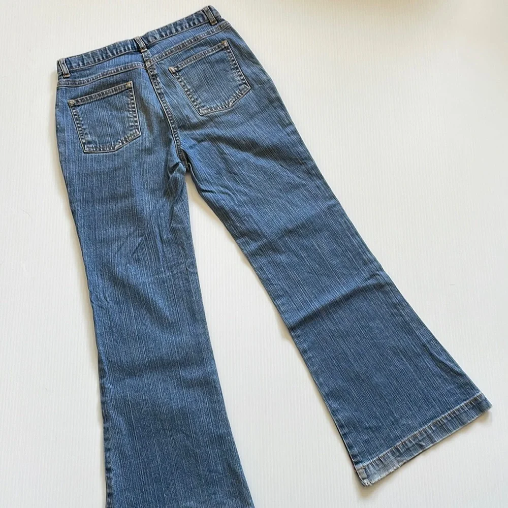 Flared Gymboree jeans with rainbow stitching & beading.  Girls size 9